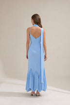 Back view of light blue maxi dress showing draping scarf