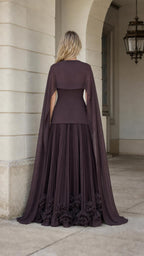 Back view showcasing flowing cape overlay