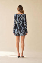 Back view of model showcasing mini dress length and fit