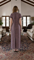 Back view of model in multi-stripe maxi dress