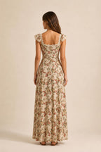 Back view of beige floral print maxi dress with square back neckline