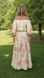 Back view of model in cream floral maxi skirt and top set