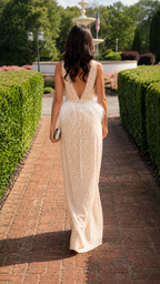 Back view of champagne wide leg jumpsuit with deep V open back and feather-look waist trim