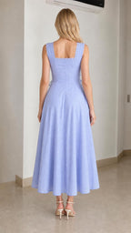 Back view of model in light blue midi dress