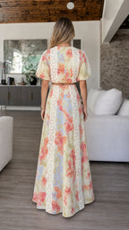 Back view of model showcasing maxi skirt and top silhouette