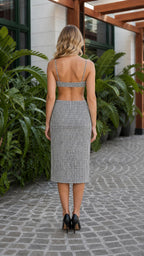 Model wearing black houndstooth two piece set back view