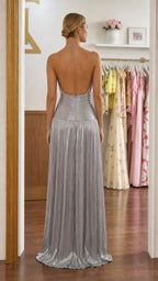 Back view showing open back design of silver maxi dress