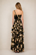 Back view of black floral maxi dress showing tiered ruffles