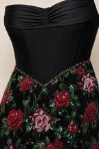 Close up of black bodice and sequin rose skirt detail