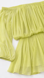 Close-up detail of chiffon fabric and sleeve on lime dress