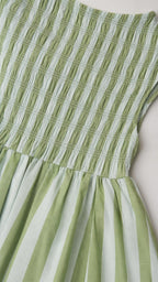 Close-up of green and white striped smocked bodice detail