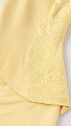 Close-up of beaded and sequined appliqué on yellow gown