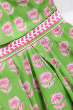 Close-up detail of green floral print and striped trim