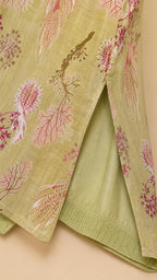 Close-up of fabric pattern and side hem slit on olive maxi dress