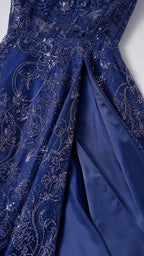 Close-up detail of the sequin embroidery and high skirt slit