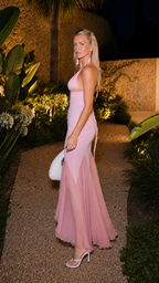 Side view of blush pink sleeveless halter formal maxi dress