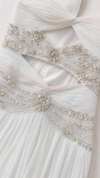 Close-up detail of crystal beaded waist trim and cutouts
