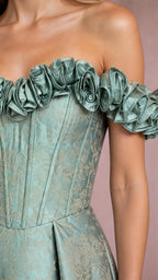Close-up detail of ruffled neckline and boned bodice on sage green gown