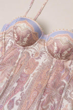 Close-up of structured sweetheart corset bodice with paisley print