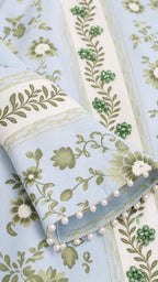 Close-up of fabric, embroidery, and pearl trim
