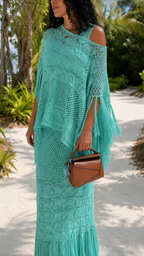 Close-up of aqua crochet open-knit texture and fringe detail