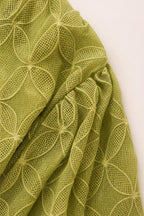 Close-up detail of the geometric textured olive fabric