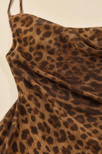Close-up texture view of brown leopard print fabric and cowl neckline
