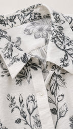Close-up detail of the collar and floral fabric pattern