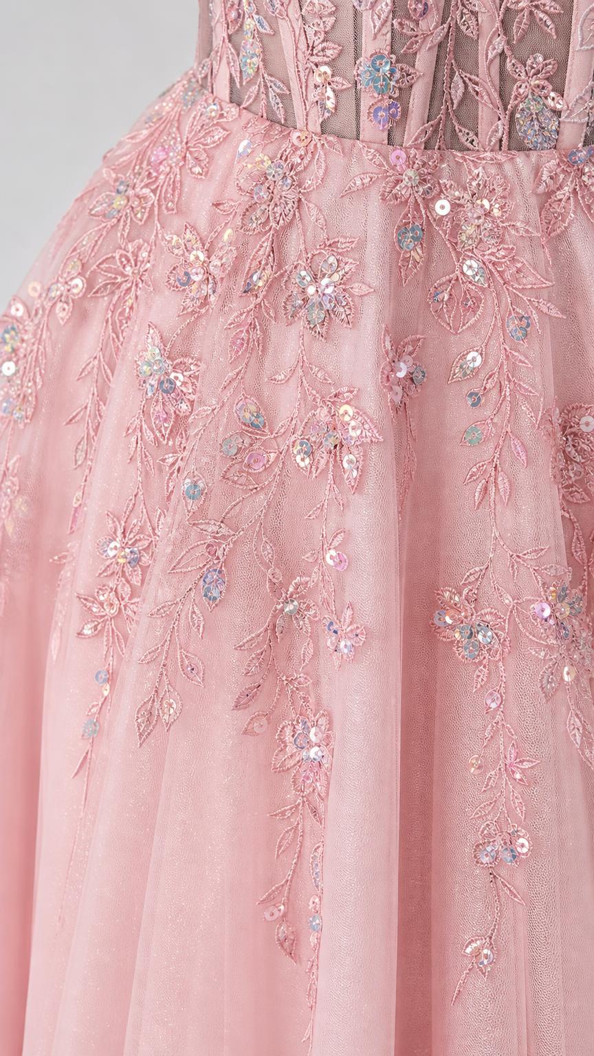 Close-up detail of floral appliques and sequins on bodice