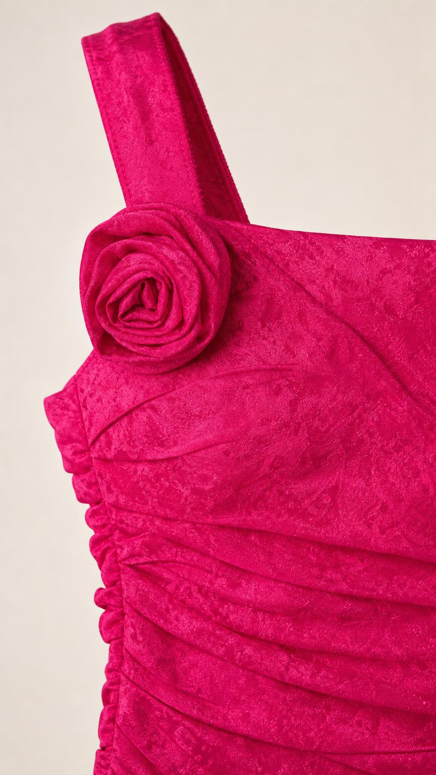 Close-up of 3D fabric rose detail and textured fabric on the strap