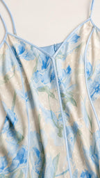 Close-up of the V-neckline, floral print, and seam detailing