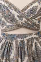 Close-up detail of the paisley wrap crop top and skirt waistband