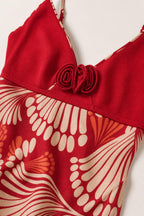 Close-up detail of bodice and floral pattern on Red dress