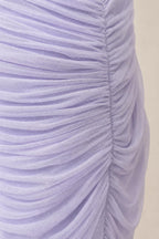 Close-up texture view of fine mesh ruching on lavender dress