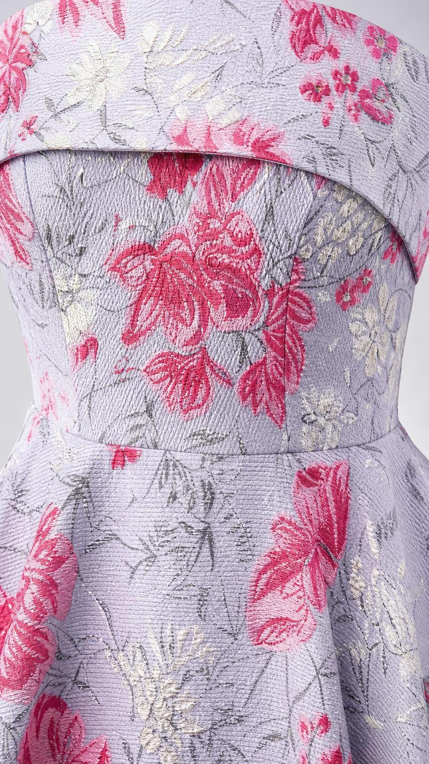Close-up of floral brocade fabric and bodice detail