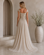 Back view of champagne floor-length shimmering A-line evening gown with cap sleeves