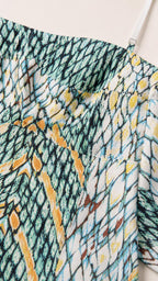 Close up of printed fabric and adjustable strap detail