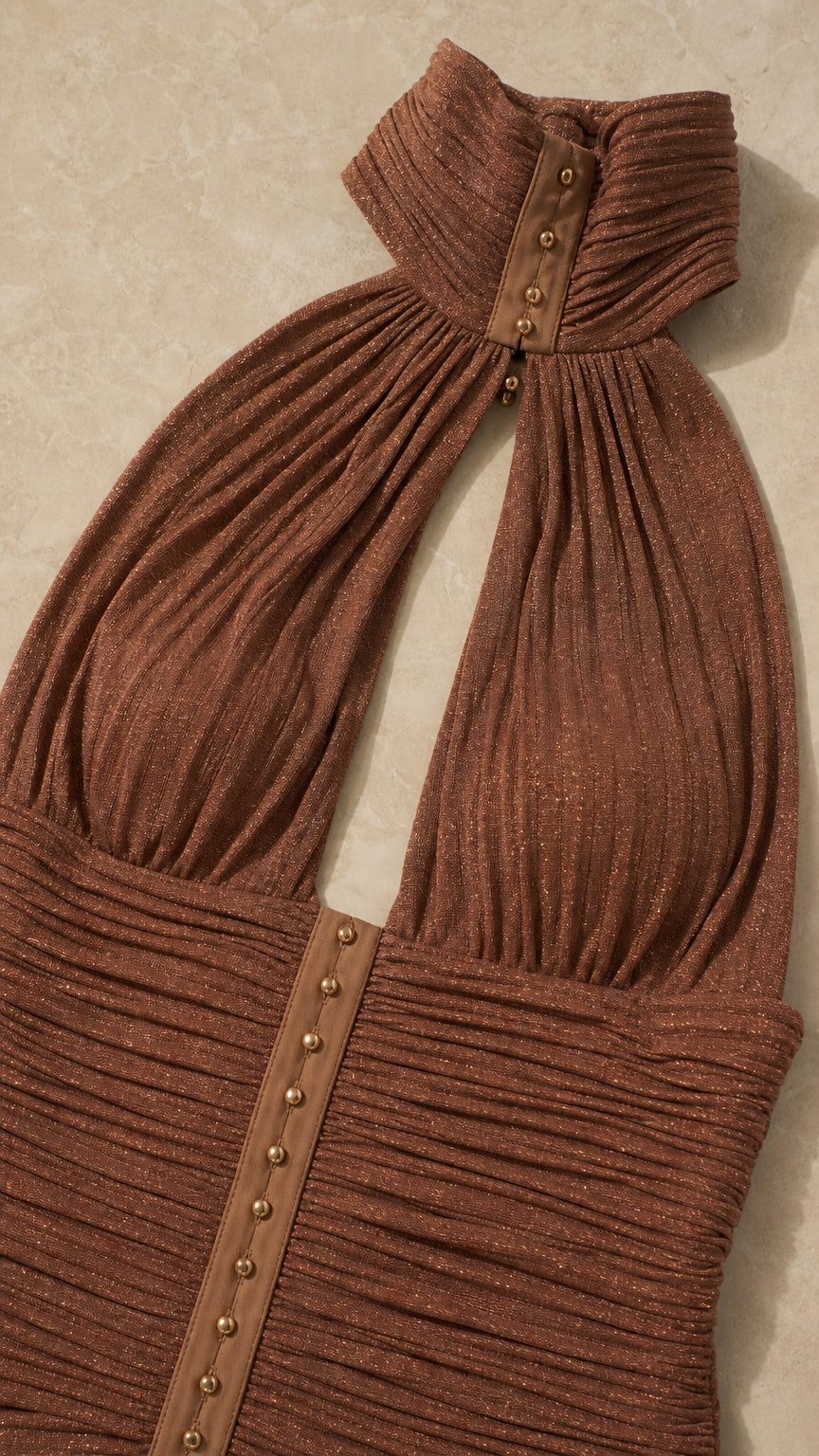 Close-up detail of the halter collar and ruched bodice