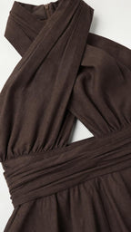 Close-up of the chocolate brown halter neckline, waist seam, and smooth-looking woven fabric