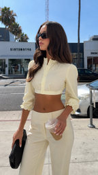Close front view of cream puff sleeve crop top and wide leg pants set