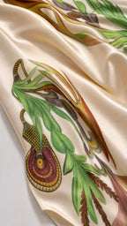 Close-up of smooth satin fabric and botanical floral print detail