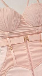 Close up of blush pink ruched bustier and corset waist detail