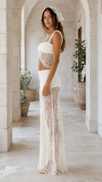 Side profile of woman in white lace matching set