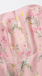 Close up detail of pink floral print fabric and neckline