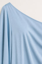 Close-up of light blue smooth fabric texture