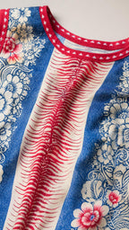 Close-up detail of the patterned fabric and red contrast trim