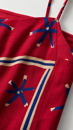 Close-up detail of red woven fabric and geometric print straps