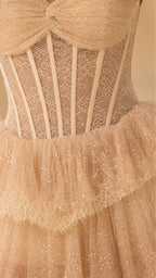 Close-up detail of structured boning and sequin tulle on champagne dress