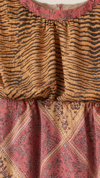 Close-up detail of neckline and fabric pattern