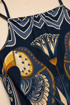 Close up detail of fabric pattern and spaghetti strap on Navy dress